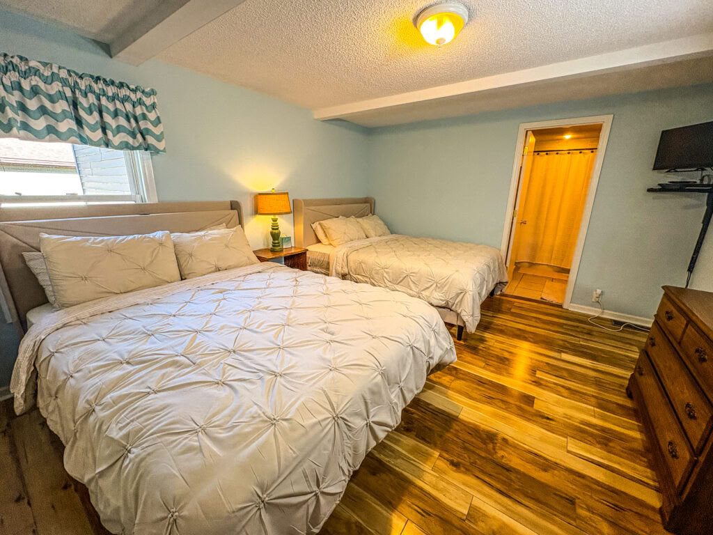 One Queen Bed in a Shared Two Queen Bedroom with Shared Bathroom